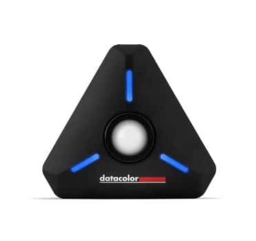 a triangular black color calibration device with blue led indicators and a circular sensor in the center featuring the brand name datacolor at the bottom digital production A triangular black color calibration device with blue LED indicators and a circular sensor in the center, featuring the brand name 'datacolor' at the bottom.