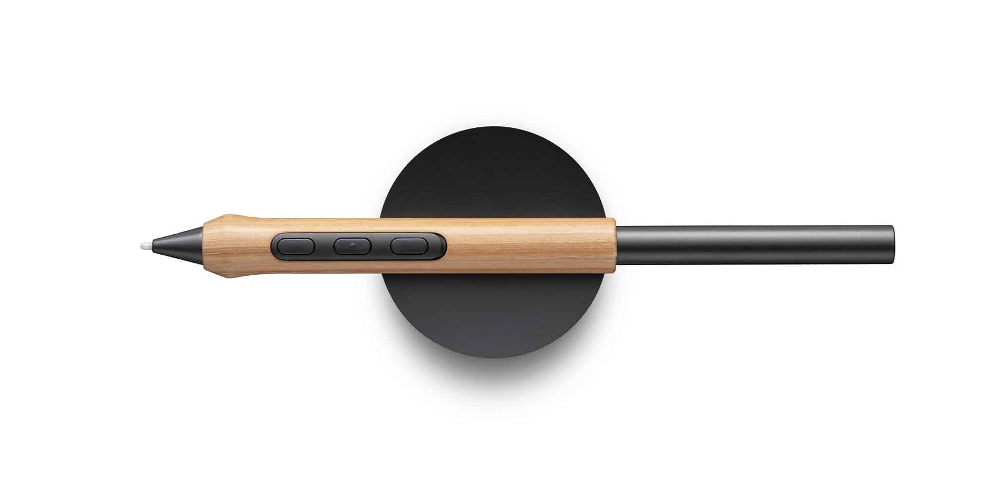 a stylus pen with a wooden grip and three buttons resting on a round black base the black pen tip is pointed towards the right side of the image digital production A stylus pen with a wooden grip and three buttons, resting on a round black base. The black pen tip is pointed towards the right side of the image.