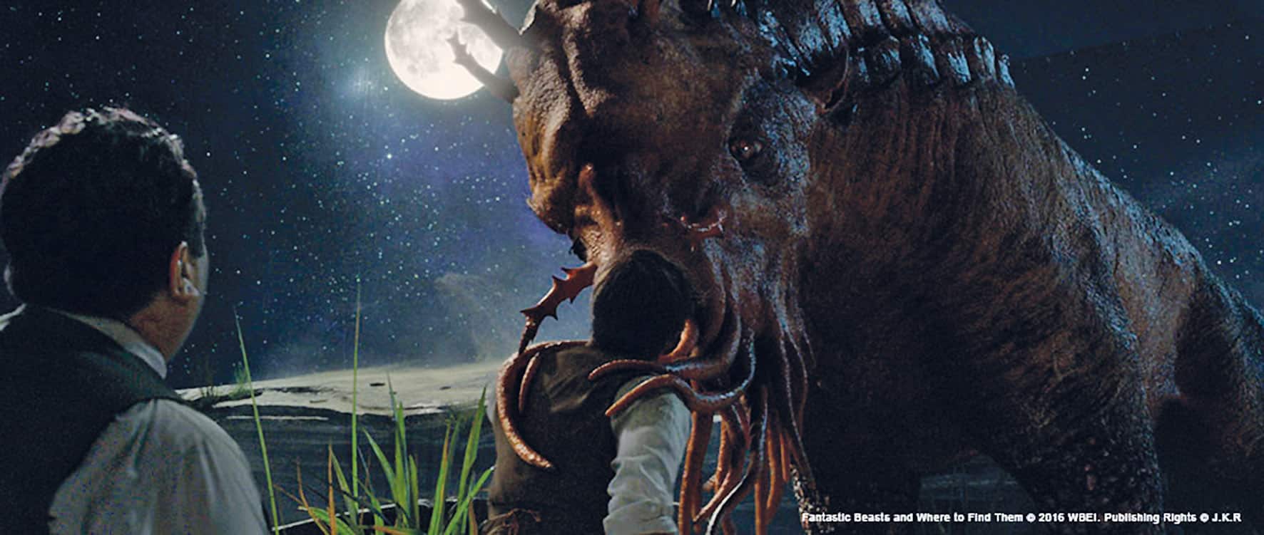 a man in formal attire stands facing a large monstrous creature under a full moon with a starry sky in the background the creature has a textured reddishbrown skin and tentacles tall grass is visible in the foreground digital production A man in formal attire stands facing a large, monstrous creature under a full moon, with a starry sky in the background. The creature has a textured, reddish-brown skin and tentacles. Tall grass is visible in the foreground.