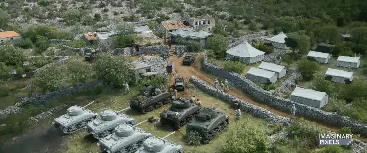 aerial view of a military encampment with tents and vehicles including tanks positioned on a dirt path surrounding the area are stone walls and vegetation indicating a remote location digital production Aerial view of a military encampment with tents and vehicles, including tanks positioned on a dirt path. Surrounding the area are stone walls and vegetation, indicating a remote location.
