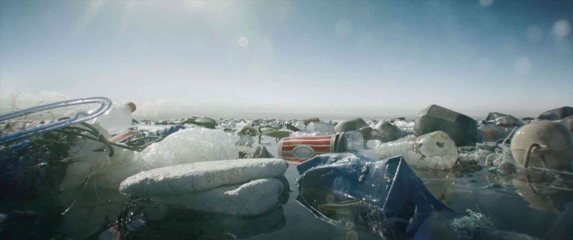 a closeup view of various plastic debris and containers floating in water with a clear sky in the background the image highlights environmental pollution caused by plastic waste digital production A close-up view of various plastic debris and containers floating in water, with a clear sky in the background. The image highlights environmental pollution caused by plastic waste.