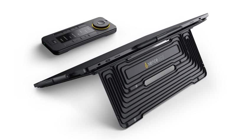 a black electronic device with a foldable stand and a remote control on a white background the device is shown in a tilted position highlighting its design and features digital production Mobile Easel