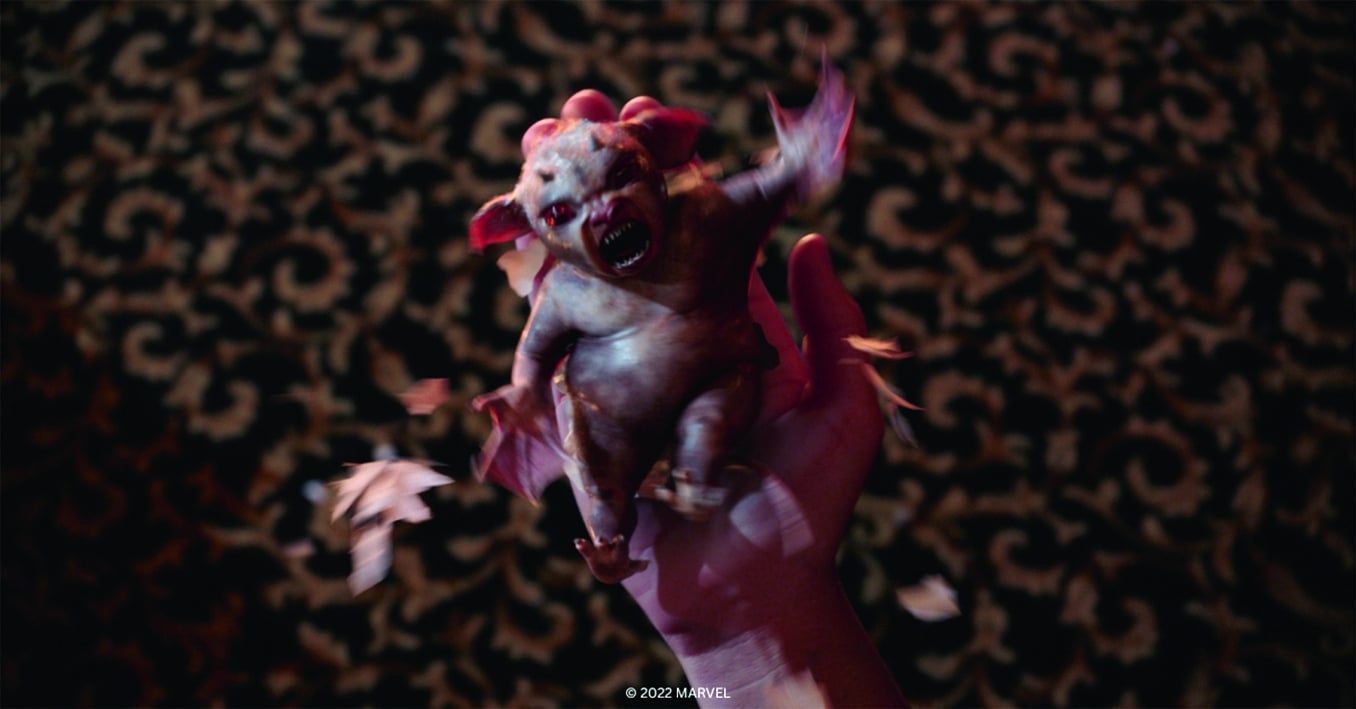a small creature held in a human hand with a fierce expression surrounded by scattered petals digital production A small creature held in a human hand with a fierce expression, surrounded by scattered petals.