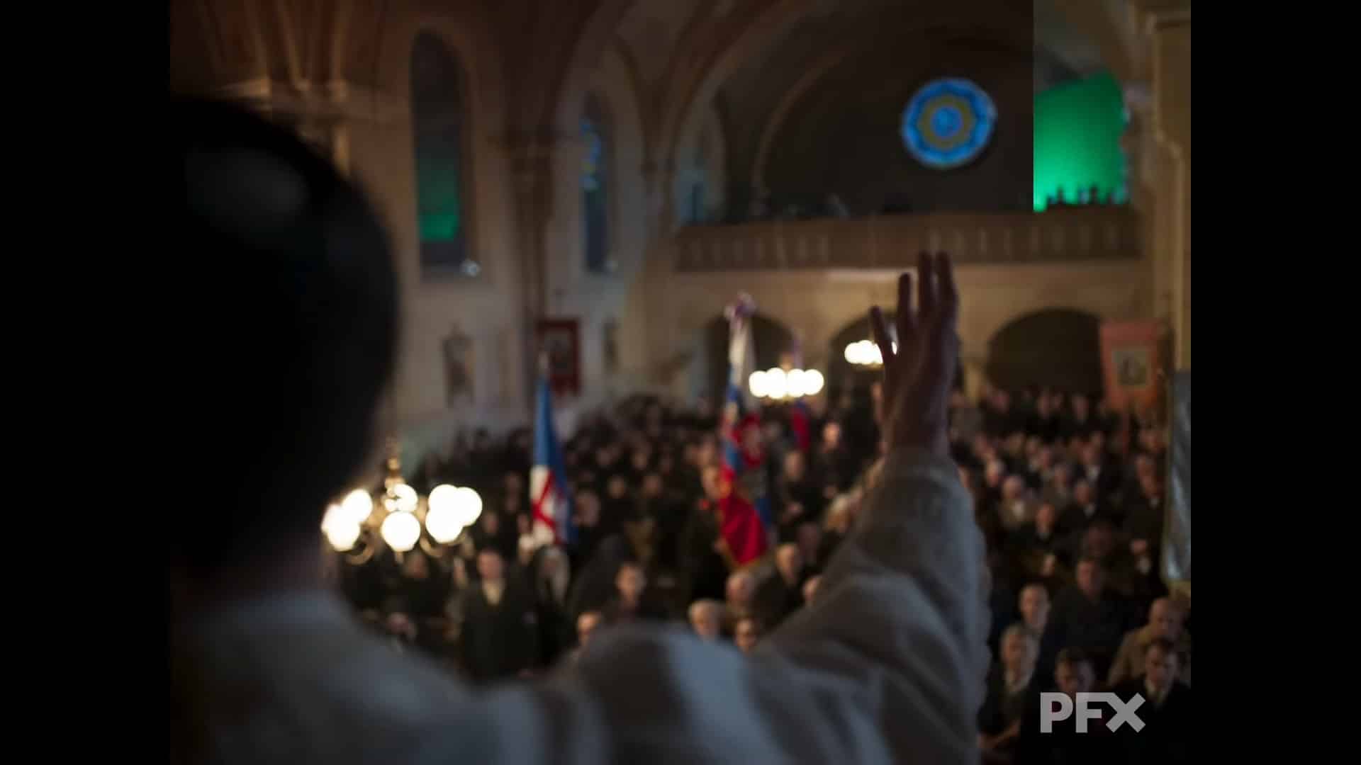 a crowd in a large hall with a speaker raising a hand digital production A crowd in a large hall with a speaker raising a hand.