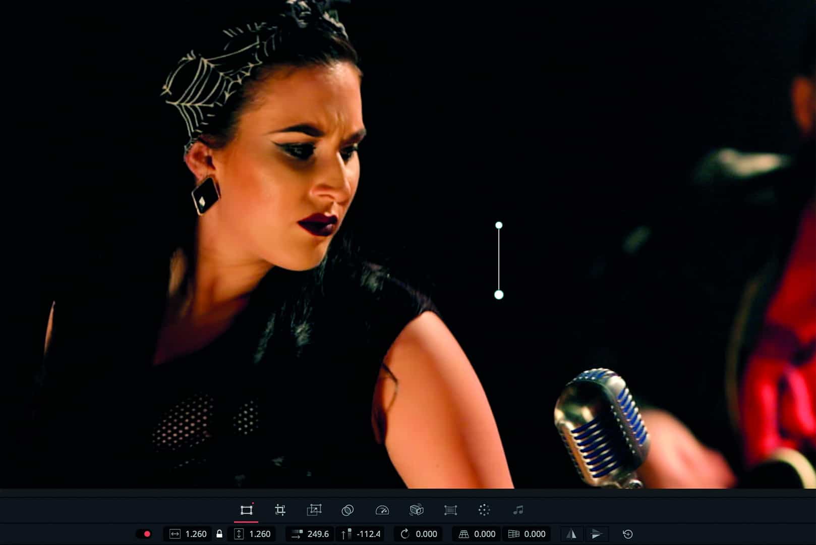 a woman with dark hair and bold makeup beside a vintage microphone digital production A woman with dark hair and bold makeup beside a vintage microphone