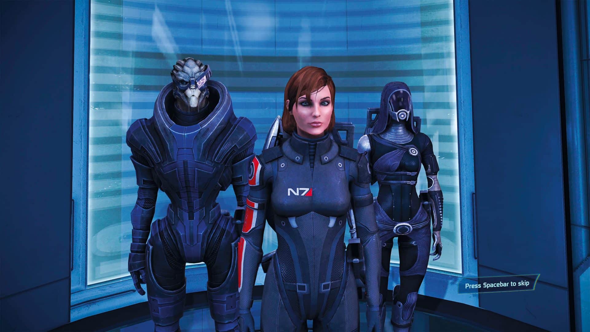three characters in futuristic suits standing together in a scifi setting digital production Three characters from the Mass Effect video game series, standing together in a futuristic environment with blue lighting.