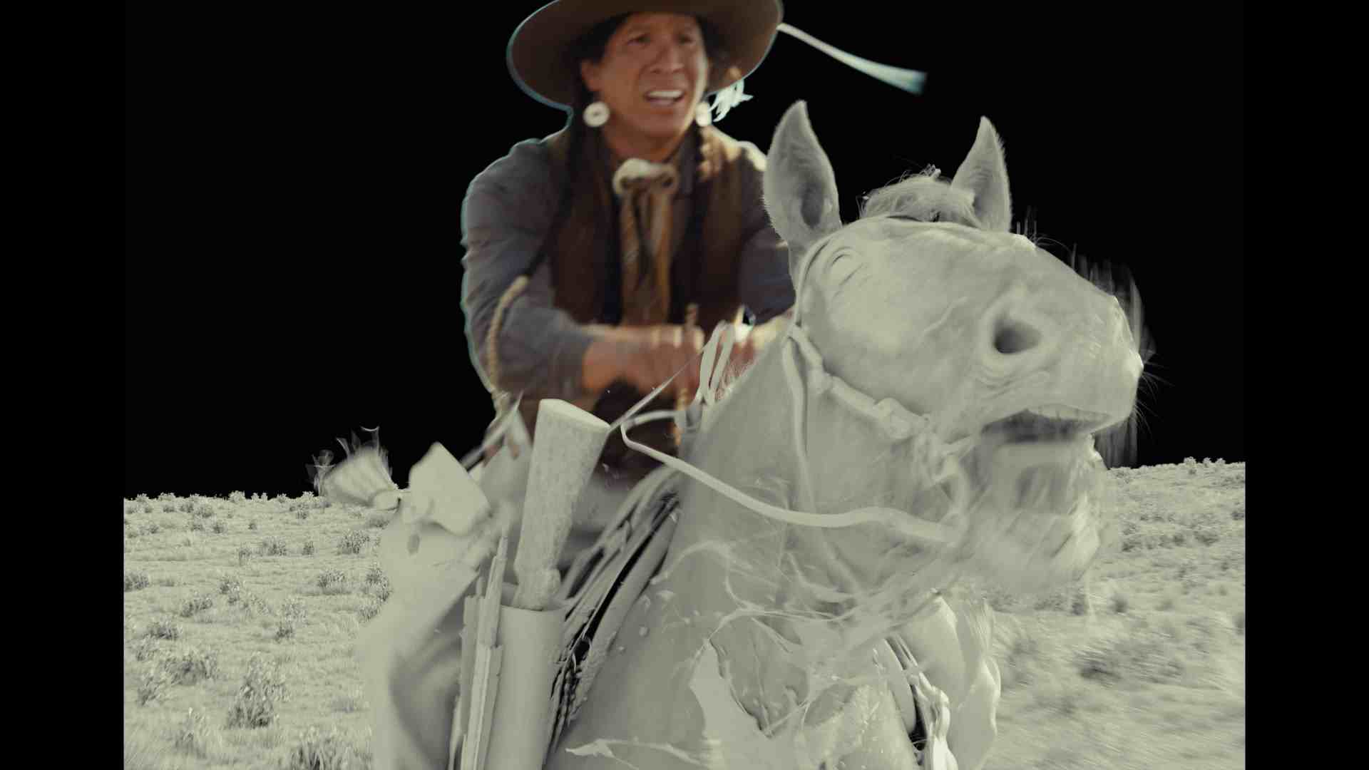 a rider in a cowboy hat holding reins and a rifle on a white horse galloping across a barren landscape with a black background digital production A rider in a cowboy hat holding reins and a rifle on a white horse galloping across a barren landscape with a black background.