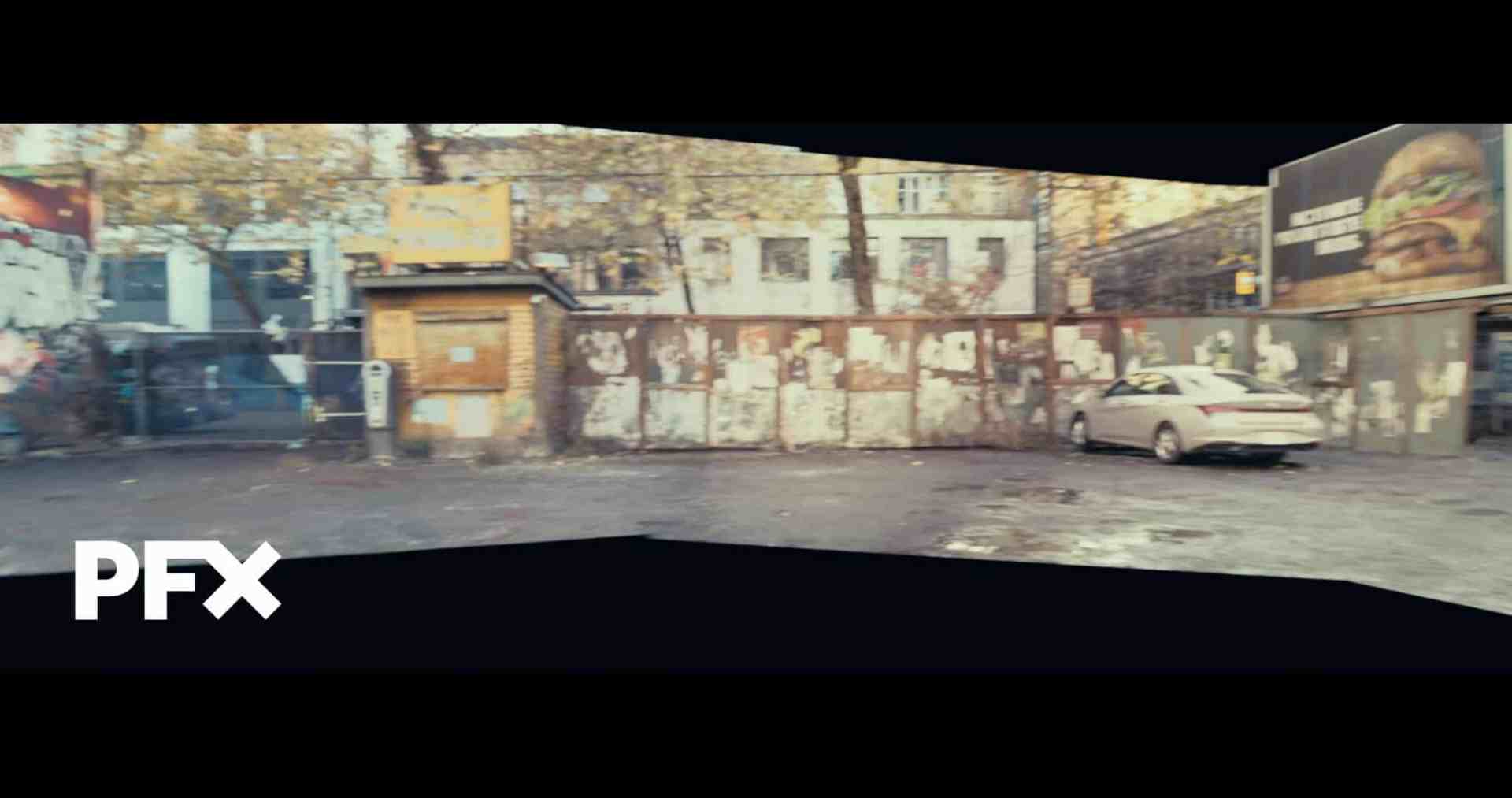 a panorama view of an urban area featuring a wall covered in faded posters a parked white car and a billboard advertising food in the background the scene is set in a partially shadowed street with trees in the vicinity digital production A panorama view of an urban area featuring a wall covered in faded posters, a parked white car, and a billboard advertising food in the background. The scene is set in a partially shadowed street with trees in the vicinity.