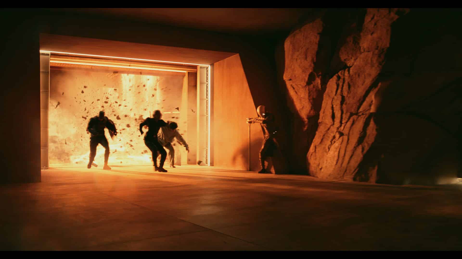 four figures moving swiftly through a dimly lit tunnel with a bright explosion behind them the atmosphere is intense and dynamic highlighted by the warm orange glow from the blast illuminating the scene digital production Four figures moving swiftly through a dimly lit tunnel, with a bright explosion behind them. The atmosphere is intense and dynamic, highlighted by the warm orange glow from the blast illuminating the scene.