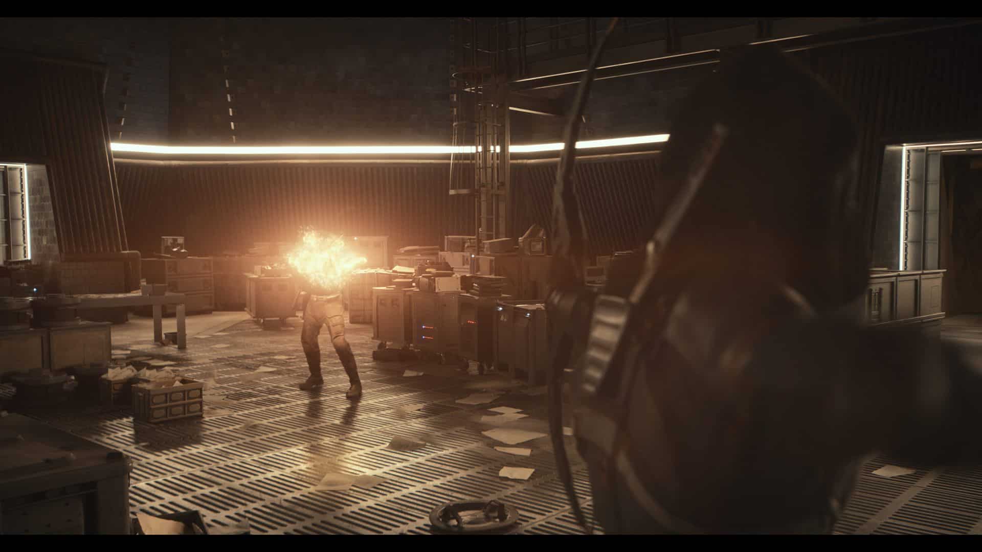 A dramatic scene in a futuristic room with low lighting, showing a character firing an energy blast while another character prepares an arrow, highlighting tension during an intense moment. Papers and equipment are scattered on the floor.