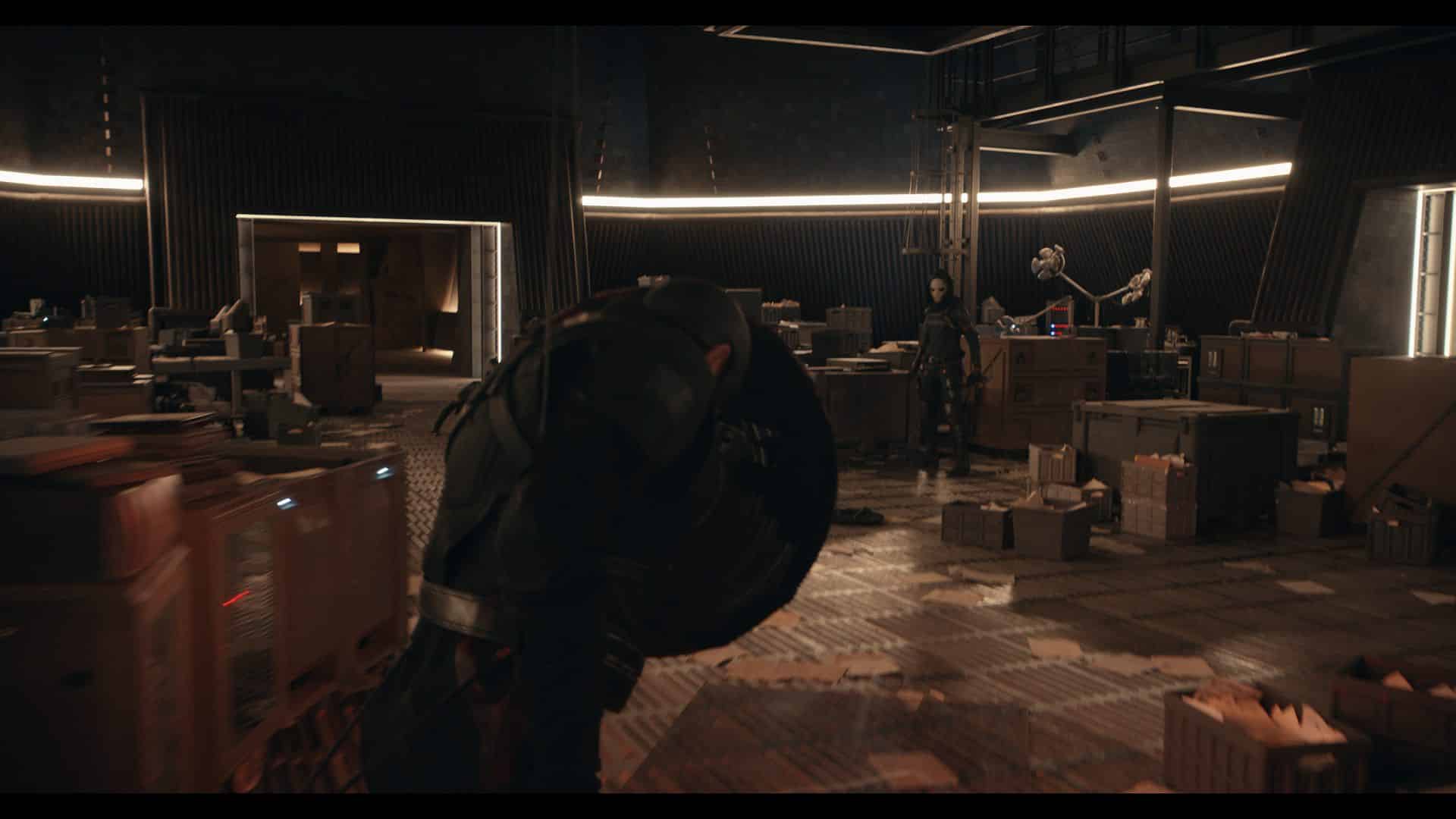 a dimly lit industrial room filled with crates showing a figure in dark armor carrying a shield while other figures are engaged in activity in the background the space has modern design elements with illuminated lines along the ceiling digital production A dimly lit industrial room filled with crates, showing a figure in dark armor carrying a shield, while other figures are engaged in activity in the background. The space has modern design elements with illuminated lines along the ceiling.