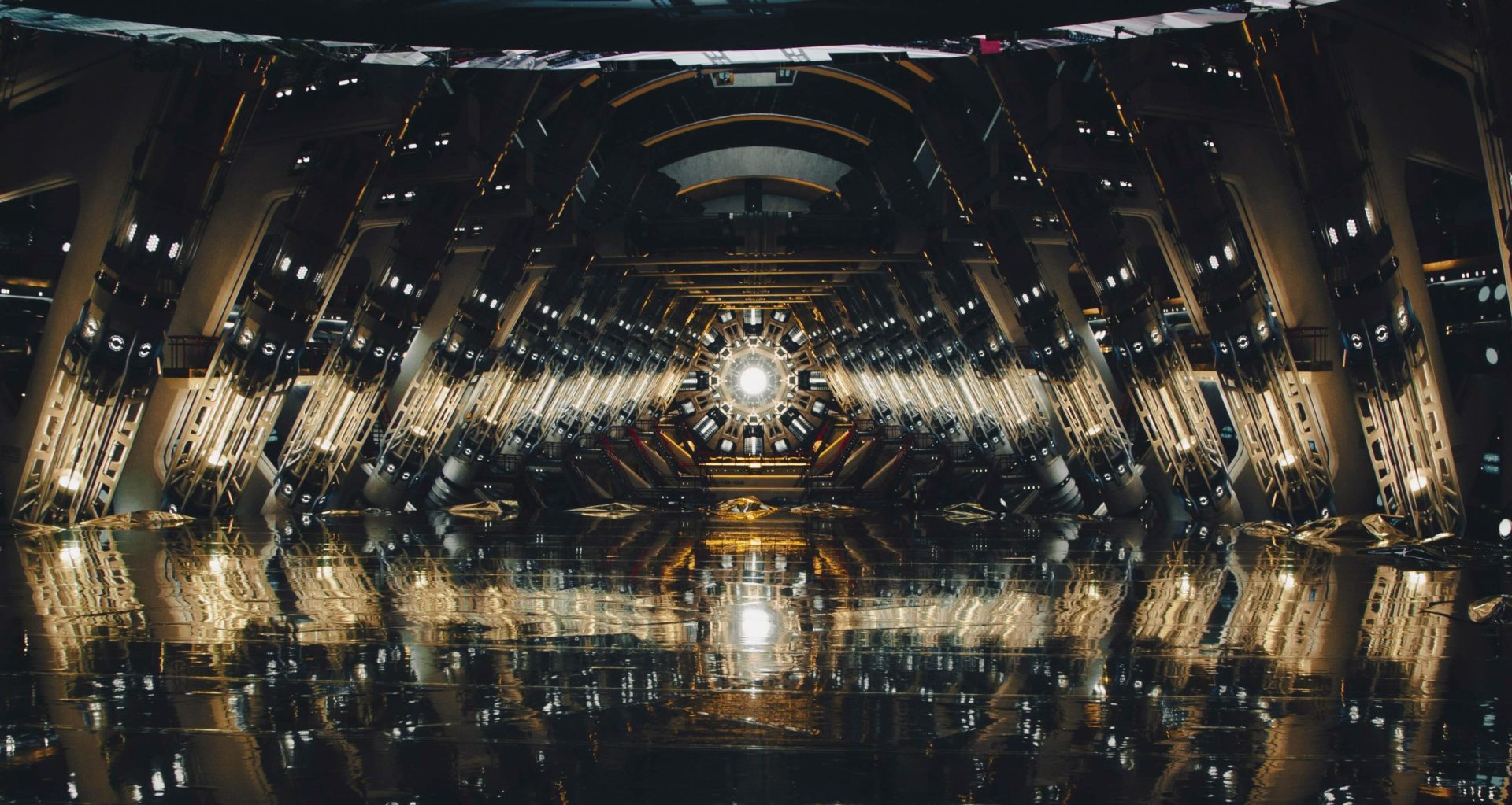 a spacious futuristic interior resembling a hightech corridor with intricate metallic designs and bright lights reflecting on a glossy floor culminating in a bright circular illumination at the far end digital production A spacious, futuristic interior resembling a high-tech corridor, with intricate metallic designs and bright lights reflecting on a glossy floor, culminating in a bright circular illumination at the far end.