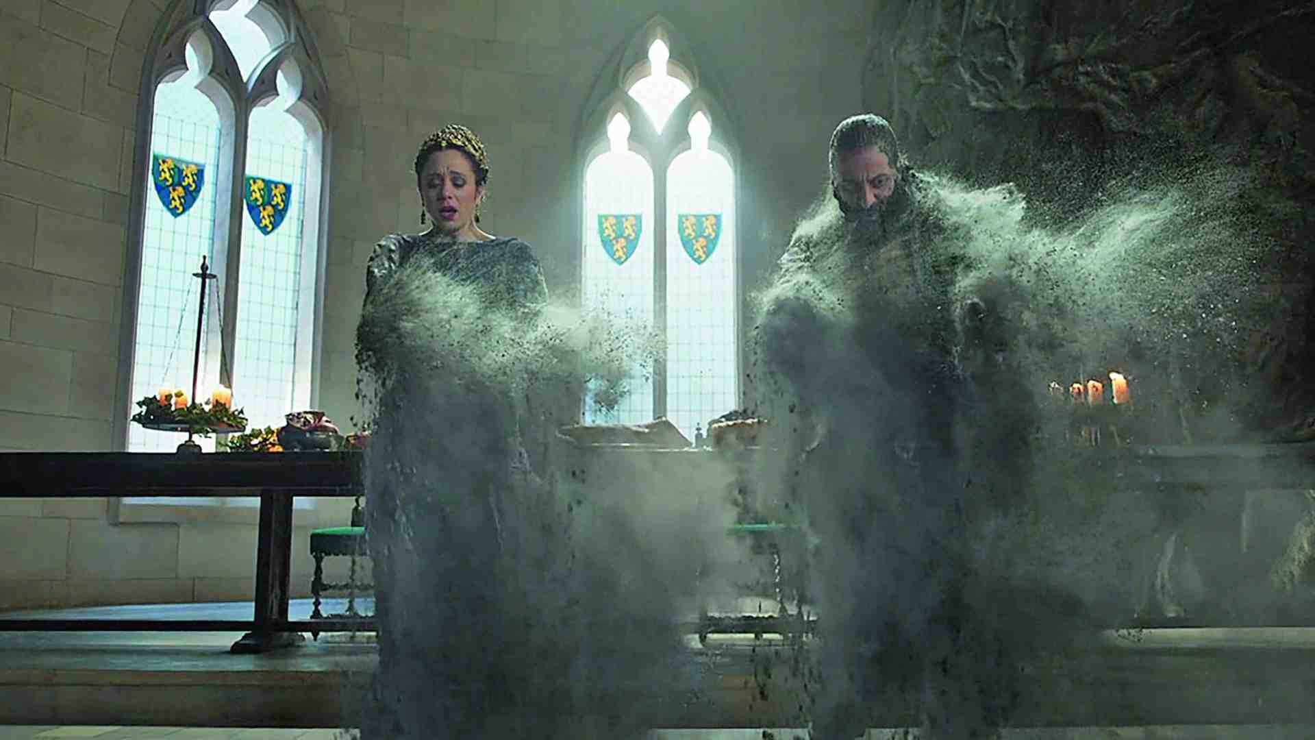 two figures in dark clothing standing in a dimly lit stone room surrounded by swirling gray mist they appear to be in a moment of transformation with an ornate table and stained glass windows in the background digital production Two figures in dark clothing standing in a dimly lit stone room, surrounded by swirling gray mist. They appear to be in a moment of transformation, with an ornate table and stained glass windows in the background.