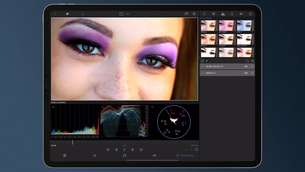 closeup of a womans face showing makeup particularly vibrant purple eyeshadow an editing software interface is visible on a tablet displaying video editing tools and a waveform monitor digital production Close-up of a woman's face showing makeup, particularly vibrant purple eyeshadow. An editing software interface is visible on a tablet, displaying video editing tools and a waveform monitor.