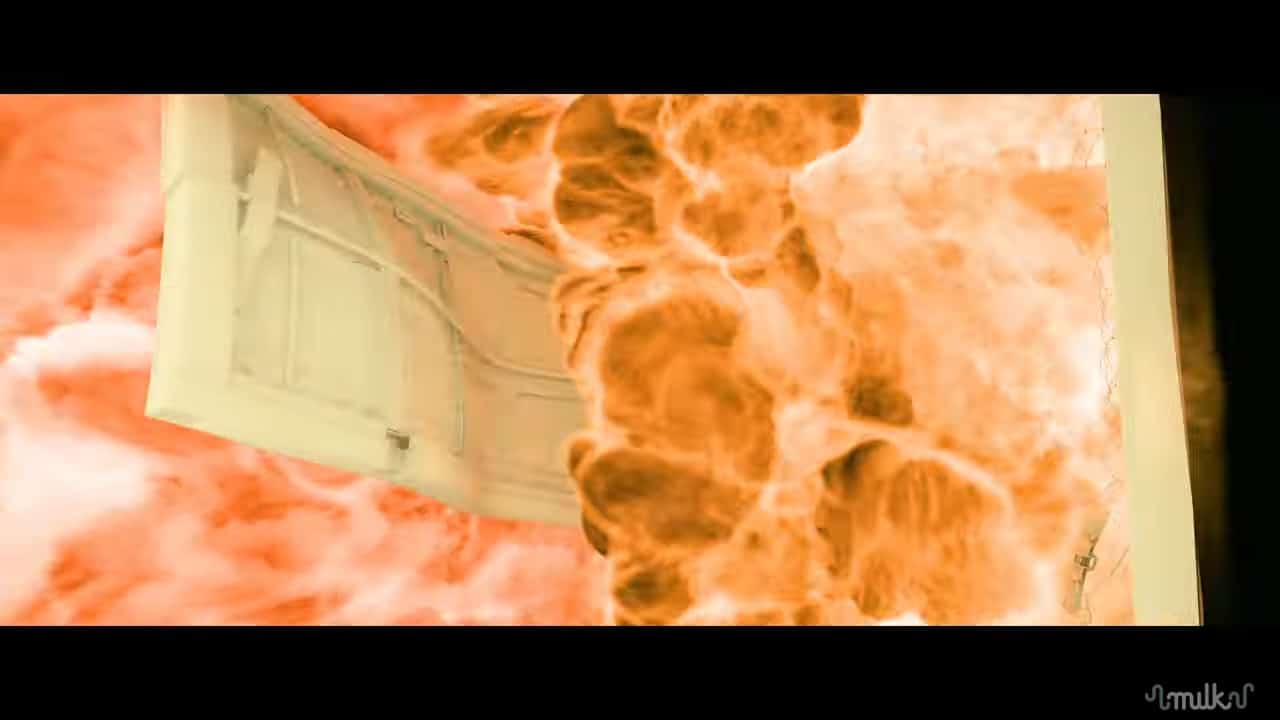 a white door is seen partially open with flames and smoke swirling in vibrant orange and red tones emerging from it digital production A white door is seen partially open, with flames and smoke swirling in vibrant orange and red tones emerging from it.