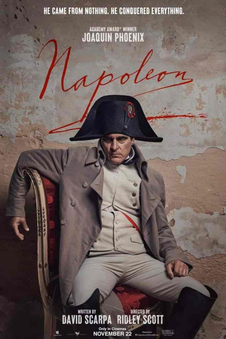 a movie poster for napoleon featuring joaquin phoenix in a historical military costume seated on a red chair the background is a textured wall the title napoleon and release date november 22 are displayed digital production A movie poster for 'Napoleon' featuring Joaquin Phoenix in a historical military costume, seated on a red chair. The background is a textured wall. The title 'Napoleon' and release date 'November 22' are displayed.