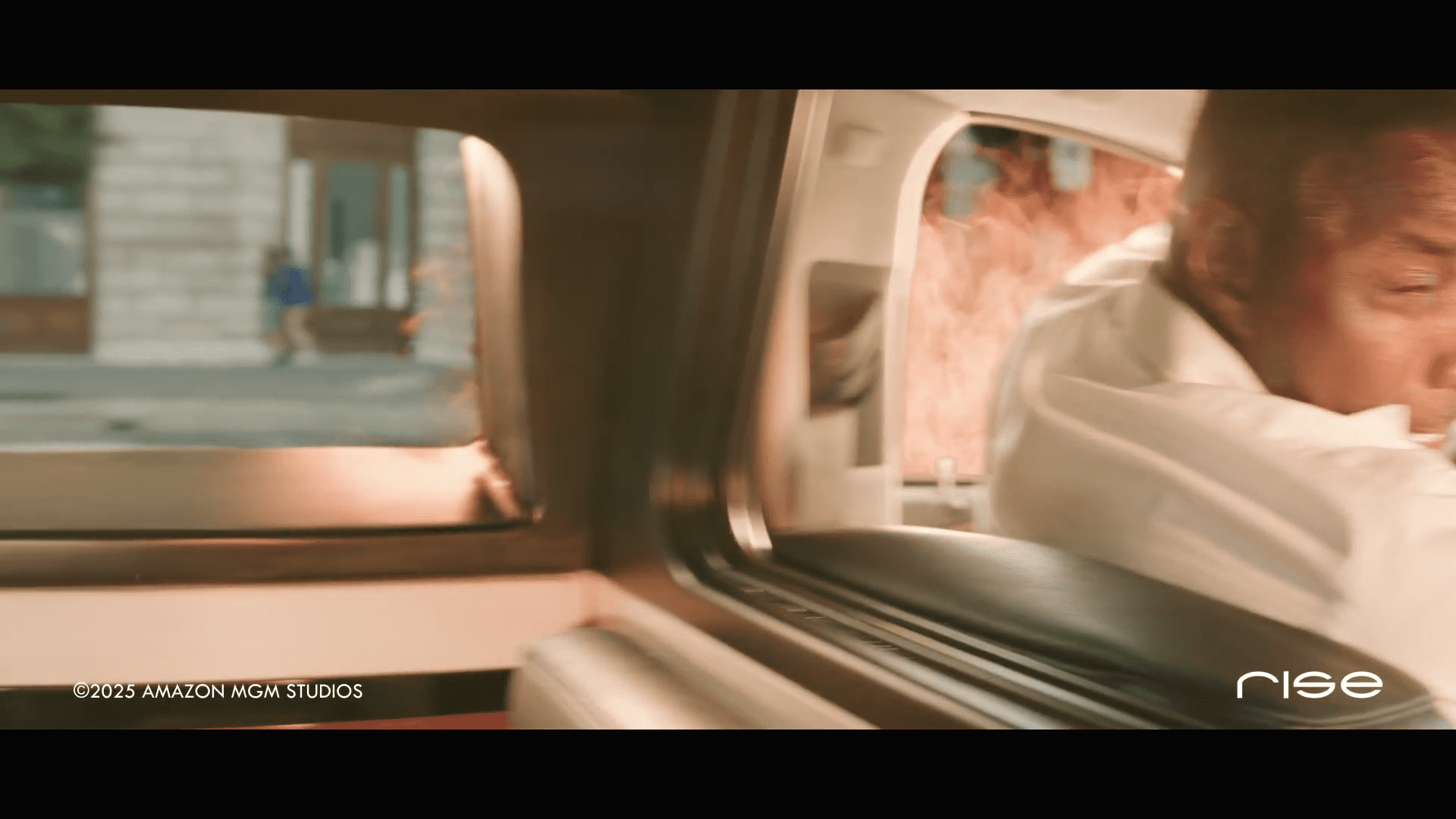 an intense scene inside a car with a man reacting as flames erupt from outside the interior shows a view of the city through the open rear window adding to the dramatic atmosphere digital production An intense scene inside a car, with a man reacting as flames erupt from outside. The interior shows a view of the city through the open rear window, adding to the dramatic atmosphere.