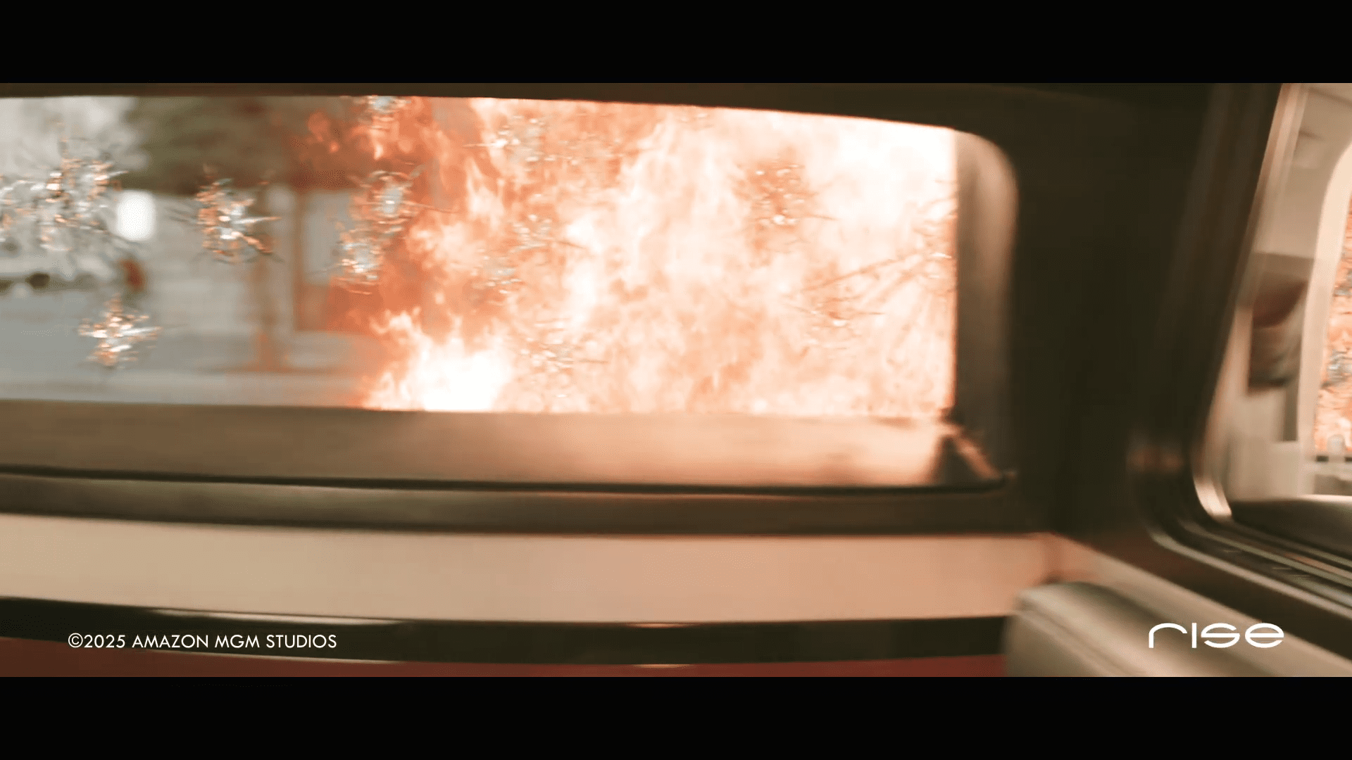 a view from inside a vehicle showing a vibrant burst of flames outside the window alongside shattered glass the scene is dramatic with reflections of light enhancing the intensity of the fire digital production A view from inside a vehicle showing a vibrant burst of flames outside the window, alongside shattered glass. The scene is dramatic, with reflections of light enhancing the intensity of the fire.