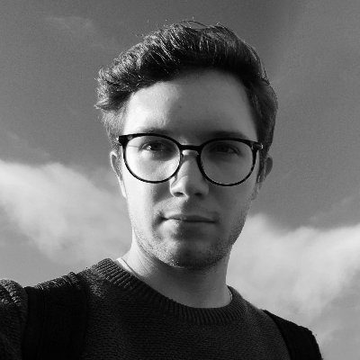 a young man with glasses and light brown hair wearing a dark sweater poses for a selfportrait against a cloudy sky the image is in black and white highlighting his facial features and expression digital production A young man with glasses and light brown hair, wearing a dark sweater, poses for a self-portrait against a cloudy sky. The image is in black and white, highlighting his facial features and expression.