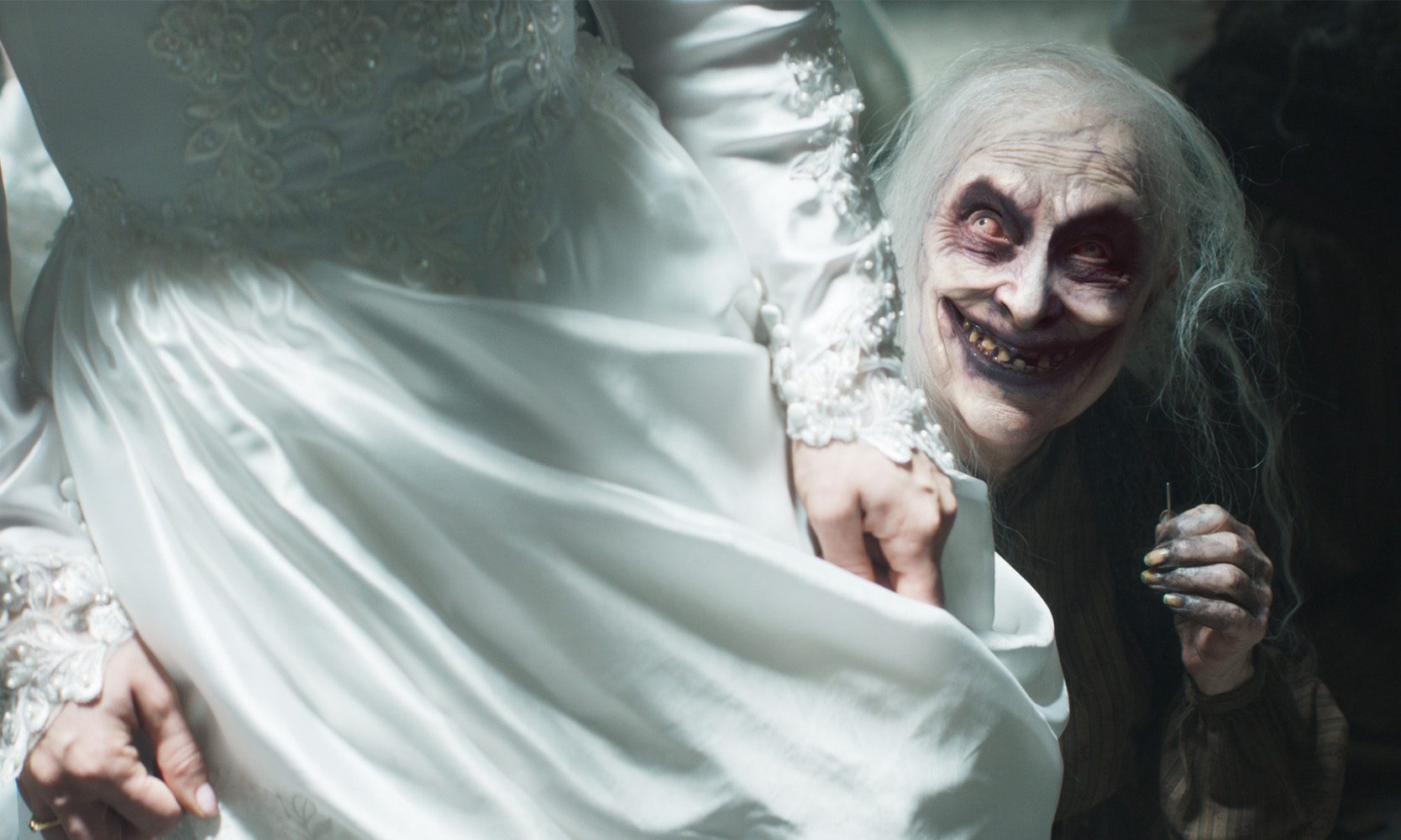 a closeup of a bride in a white wedding dress standing with her hand on the fabric behind her an eerie figure with pale skin and an unsettling smile peeks from the shadows adding a sense of unease to the scene digital production A close-up of a bride in a white wedding dress, standing with her hand on the fabric. Behind her, an eerie figure with pale skin and an unsettling smile peeks from the shadows, adding a sense of unease to the scene.