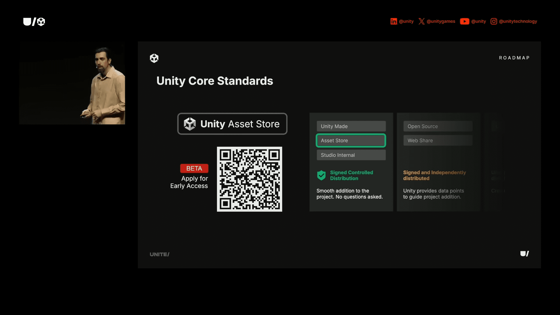 a presenter stands on stage discussing unity core standards the slide features unity asset store with a qr code and options for unity mode open source and asset store the background is dark with techthemed graphics digital production A presenter stands on stage, discussing Unity Core Standards. The slide features 'Unity Asset Store' with a QR code, and options for Unity Mode, Open Source, and Asset Store. The background is dark with tech-themed graphics.