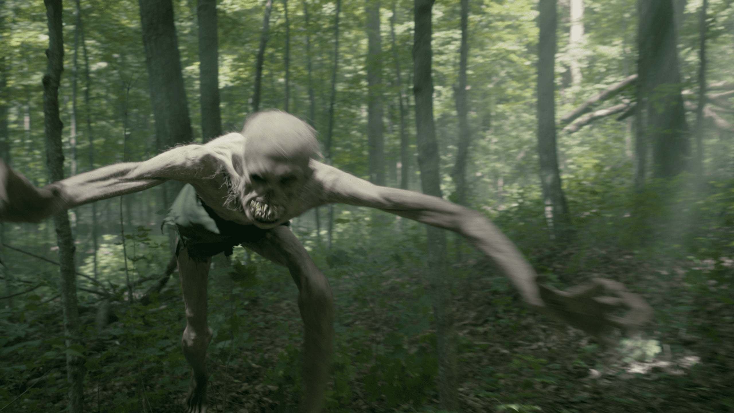 a humanoid creature with elongated limbs and a skeletal appearance moving swiftly through a dense forest surrounded by green foliage and shafts of light filtering through the trees digital production A humanoid creature with elongated limbs and a skeletal appearance moving swiftly through a dense forest, surrounded by green foliage and shafts of light filtering through the trees.