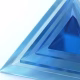 A series of transparent blue acrylic pyramids arranged with varying sizes, showcasing a smooth surface and reflecting light against a white background.