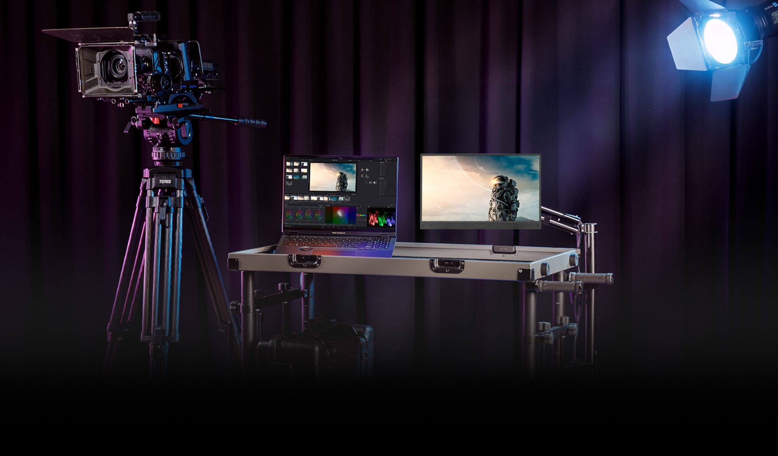 a professional video production setup featuring a camera on a tripod a laptop displaying editing software and a monitor showing an outdoor image all arranged on a table with a spotlight illuminating the scene against a dark background digital production A professional video production setup featuring a camera on a tripod, a laptop displaying editing software, and a monitor showing an outdoor image, all arranged on a table with a spotlight illuminating the scene against a dark background.