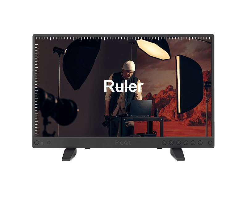a professional monitor displaying a scene from a photography studio featuring a person in a hat working at a desk softbox lights illuminate the backdrop of redtoned scenery the word ruler is visible on the screen digital production A professional monitor displaying a scene from a photography studio, featuring a person in a hat working at a desk. Softbox lights illuminate the backdrop of red-toned scenery. The word 'Ruler' is visible on the screen.