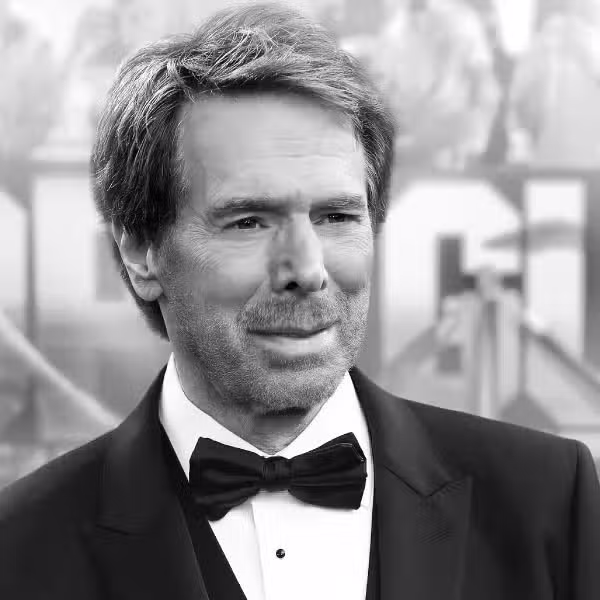 a man wearing a black tuxedo and bow tie standing against a blurred event backdrop he has short light brown hair and a light beard presenting a neutral expression digital production https://vesglobal.org/wp-content/uploads/2026/01/24th-Annual-Awards_Jerry-Bruckheimer-600x600-1.jpg.avif