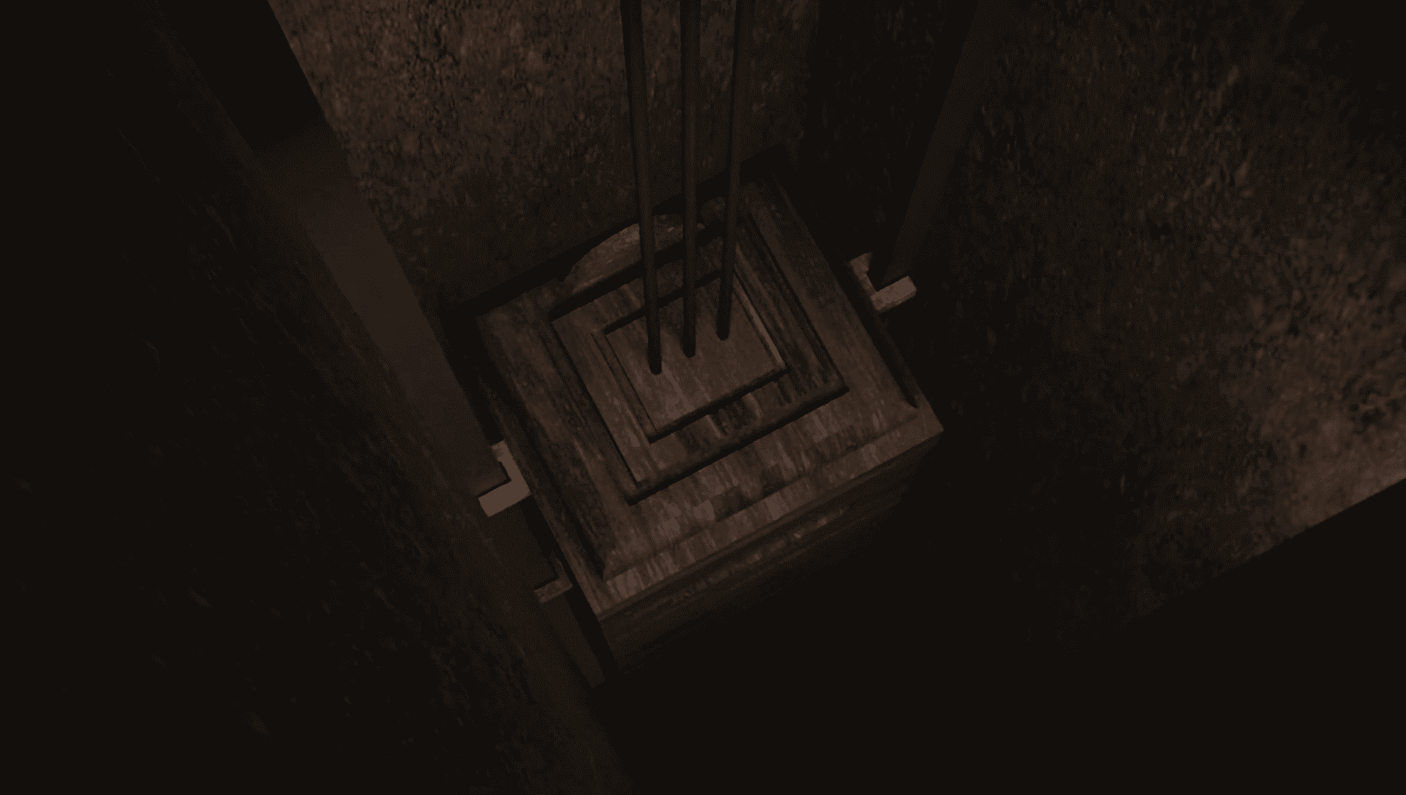 a view looking down into a dimly lit shaft showcasing a wooden platform at the bottom with several metal cables extending upwards along the walls surrounded by roughtextured surfaces digital production A view looking down into a dimly lit shaft, showcasing a wooden platform at the bottom with several metal cables extending upwards along the walls, surrounded by rough-textured surfaces.
