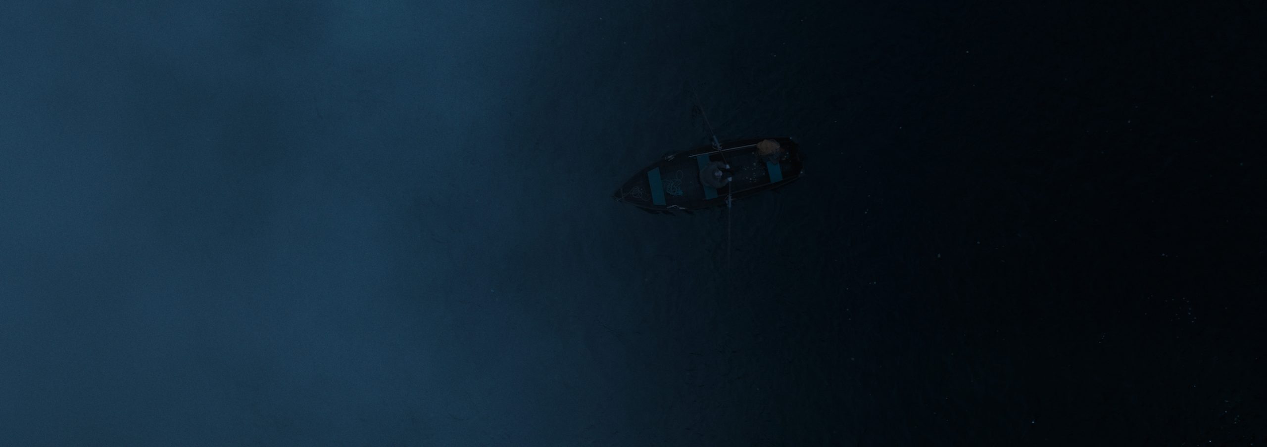 a small boat floating in dark waters surrounded by deep blue mist creating an atmosphere of solitude and mystery digital production A small boat floating in dark waters, surrounded by deep blue mist, creating an atmosphere of solitude and mystery.