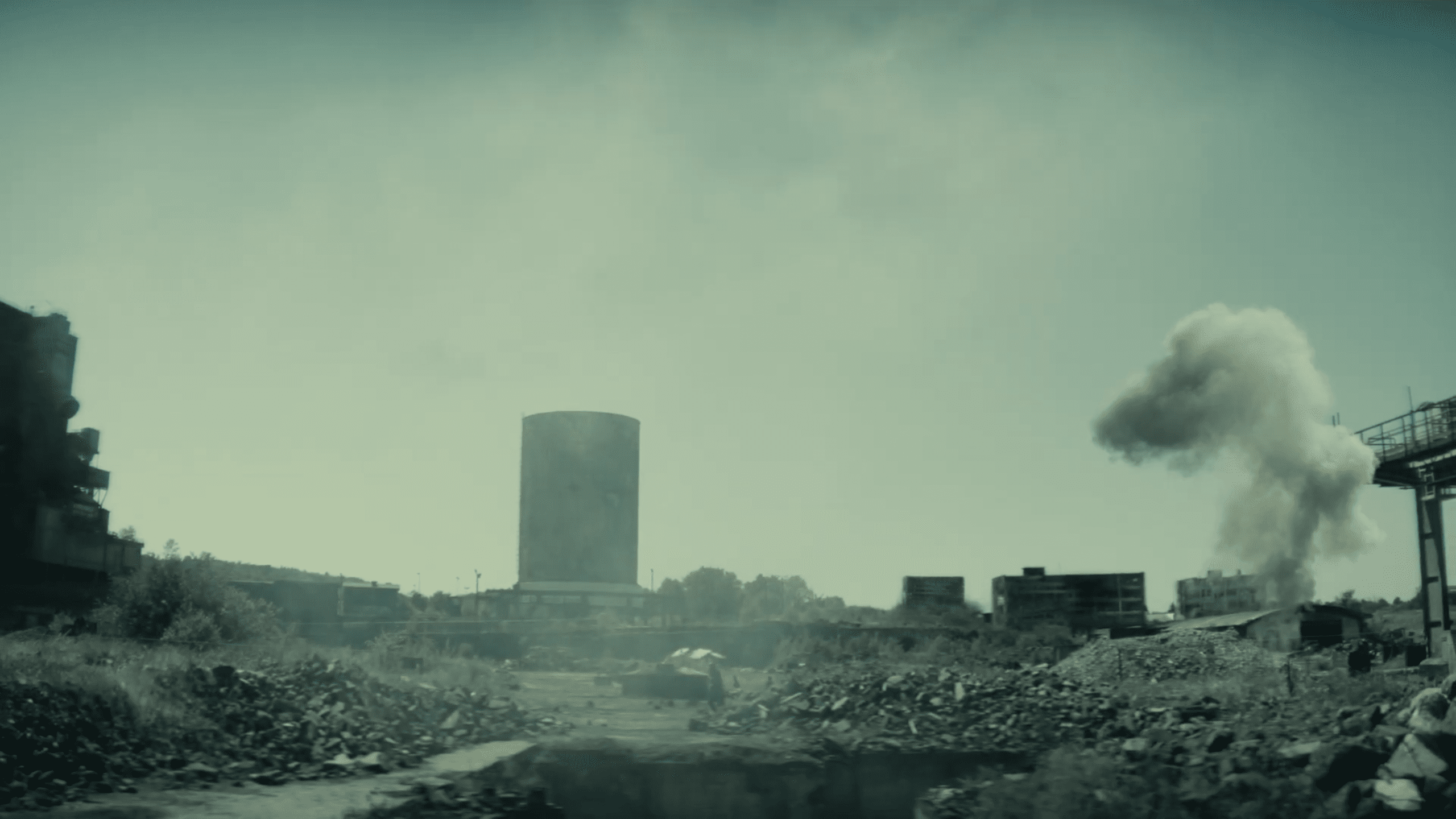 a desolate urban landscape featuring a large cylindrical tower amidst crumbling buildings in the background a plume of smoke rises into the air while the foreground shows rubble and debris scattered across the ground digital production A desolate urban landscape featuring a large, cylindrical tower amidst crumbling buildings. In the background, a plume of smoke rises into the air, while the foreground shows rubble and debris scattered across the ground.