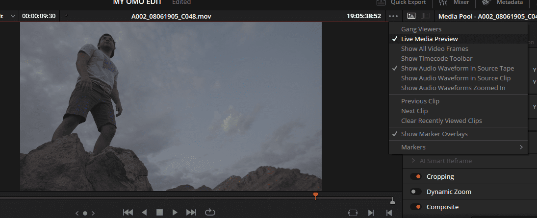 a person stands on a rocky outcrop against a cloudy sky gazing into the distance the scene is edited in video editing software showing a timeline and media controls on the right side digital production A person stands on a rocky outcrop against a cloudy sky, gazing into the distance. The scene is edited in video editing software, showing a timeline and media controls on the right side.