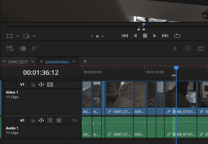 screenshot of a video editing software interface showing a timeline view it displays multiple video and audio tracks including clips labeled with codes playback controls and a timer indicating the current position in the video digital production Screenshot of a video editing software interface showing a timeline view. It displays multiple video and audio tracks, including clips labeled with codes, playback controls, and a timer indicating the current position in the video.