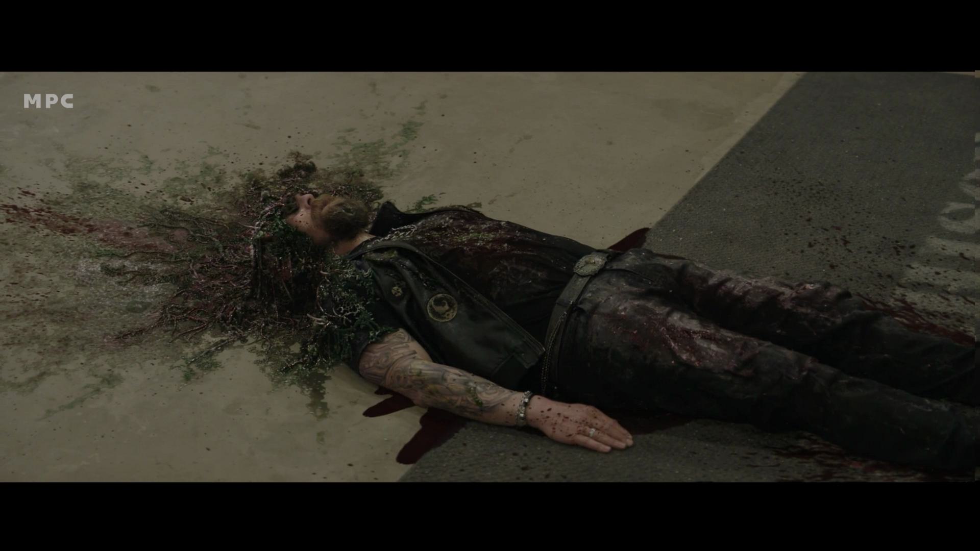 a person lying on the ground surrounded by dark stains the figure appears to have been in an incident with visible markings and debris around the setting is dimly lit with a rough surface beneath digital production A person lying on the ground, surrounded by dark stains. The figure appears to have been in an incident, with visible markings and debris around. The setting is dimly lit with a rough surface beneath.