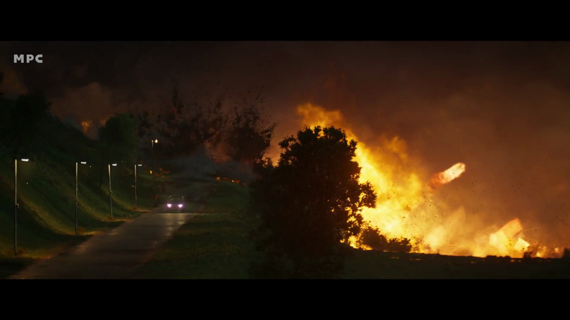 a nighttime scene depicting a road lined with streetlights leading toward a large fire on the hillside bright flames and smoke rise against a dark sky suggesting a dramatic event in the distance digital production A nighttime scene depicting a road lined with streetlights, leading toward a large fire on the hillside. Bright flames and smoke rise against a dark sky, suggesting a dramatic event in the distance.