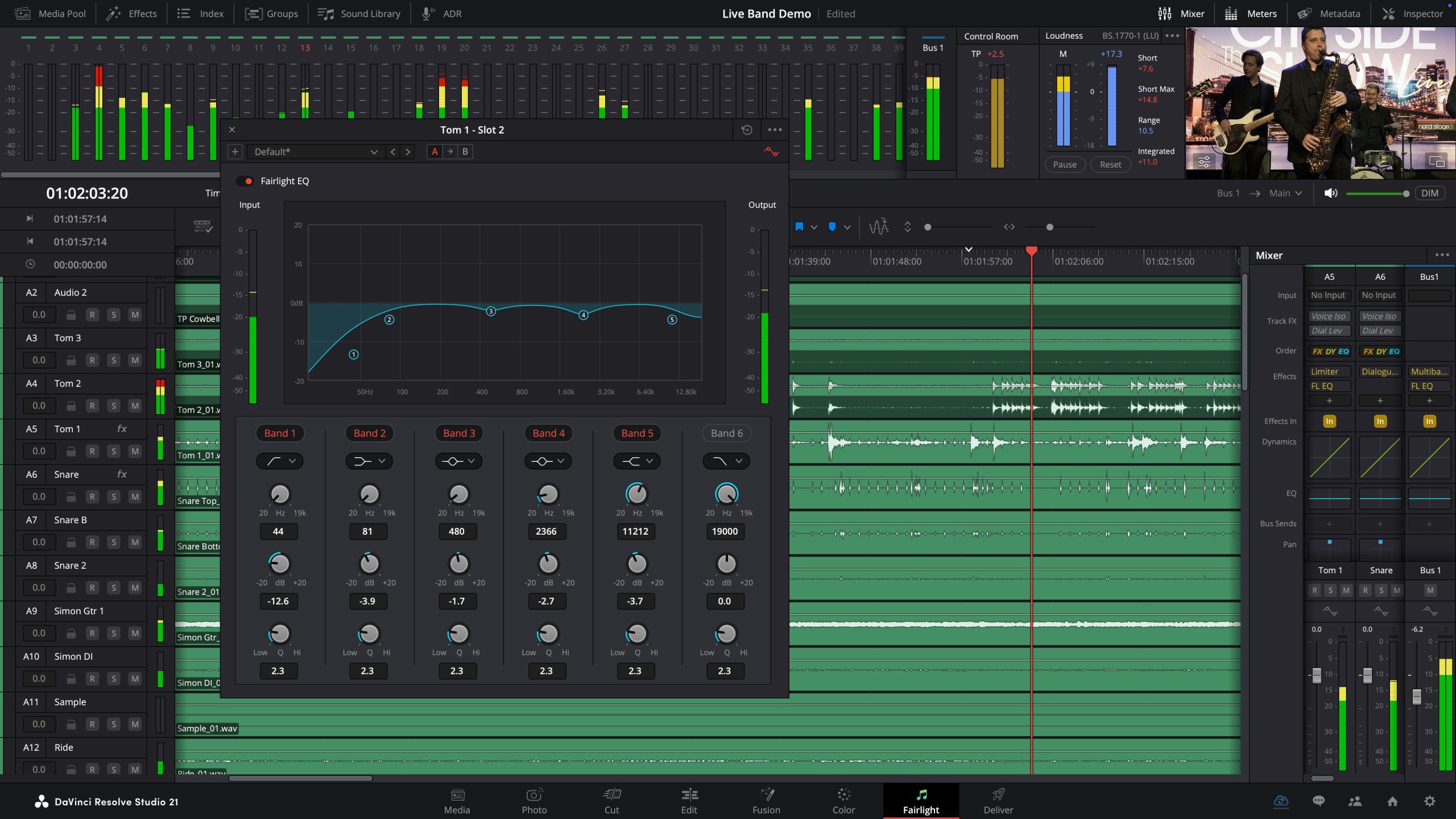 the image displays a computer screen showcasing a live sound mixing software interface various audio tracks are highlighted in green with vertical meters indicating sound levels a central equalizer graphic adjusts sound frequencies while a video preview shows two musicians performing in the background digital production The image displays a computer screen showcasing a live sound mixing software interface. Various audio tracks are highlighted in green, with vertical meters indicating sound levels. A central equalizer graphic adjusts sound frequencies, while a video preview shows two musicians performing in the background.