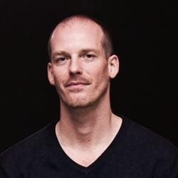 a man with a confident expression stands against a dark background wearing a fitted black sweater his short hair is neatly styled and his calm demeanor exudes a sense of selfassuredness the soft lighting highlights his facial features adding depth to the scene digital production A man with a confident expression stands against a dark background, wearing a fitted black sweater. His short hair is neatly styled, and his calm demeanor exudes a sense of self-assuredness. The soft lighting highlights his facial features, adding depth to the scene.