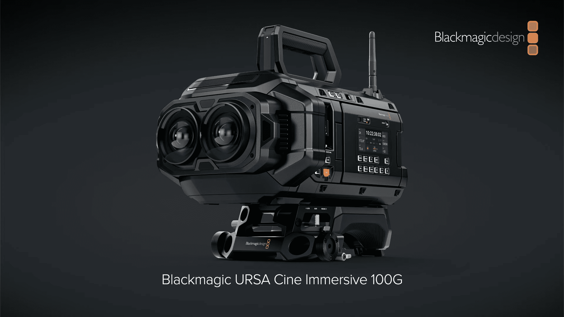 the blackmagic ursa cine immersive 100g camera is featured prominently showcasing a sleek modern design its robust black body includes dual lenses providing a hightech appearance the camera sits on a sturdy support with a minimalistic backdrop enhancing its professional aesthetic brand name visible above digital production The Blackmagic URSA Cine Immersive 100G camera is featured prominently, showcasing a sleek, modern design. Its robust black body includes dual lenses, providing a high-tech appearance. The camera sits on a sturdy support, with a minimalistic backdrop enhancing its professional aesthetic. Brand name visible above.