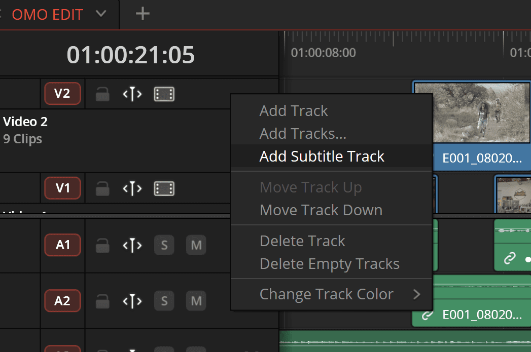 a screenshot of a video editing interface shows a timeline with clips organized in tracks options for adding tracks and managing subtitle tracks are displayed in a dropdown menu the timeline features a dark background with green and blue sections representing different media digital production A screenshot of a video editing interface shows a timeline with clips organized in tracks. Options for adding tracks and managing subtitle tracks are displayed in a dropdown menu. The timeline features a dark background with green and blue sections representing different media.