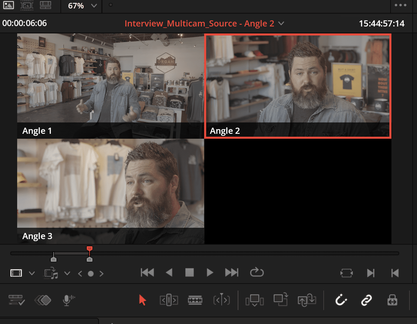 a video editing interface displays three angles of a man with a thick beard speaking the primary focus is on angle 2 highlighting his engaging expression while the background is filled with neatly arranged clothing items creating a vibrant retail atmosphere digital production A video editing interface displays three angles of a man with a thick beard speaking. The primary focus is on Angle 2, highlighting his engaging expression, while the background is filled with neatly arranged clothing items, creating a vibrant retail atmosphere.