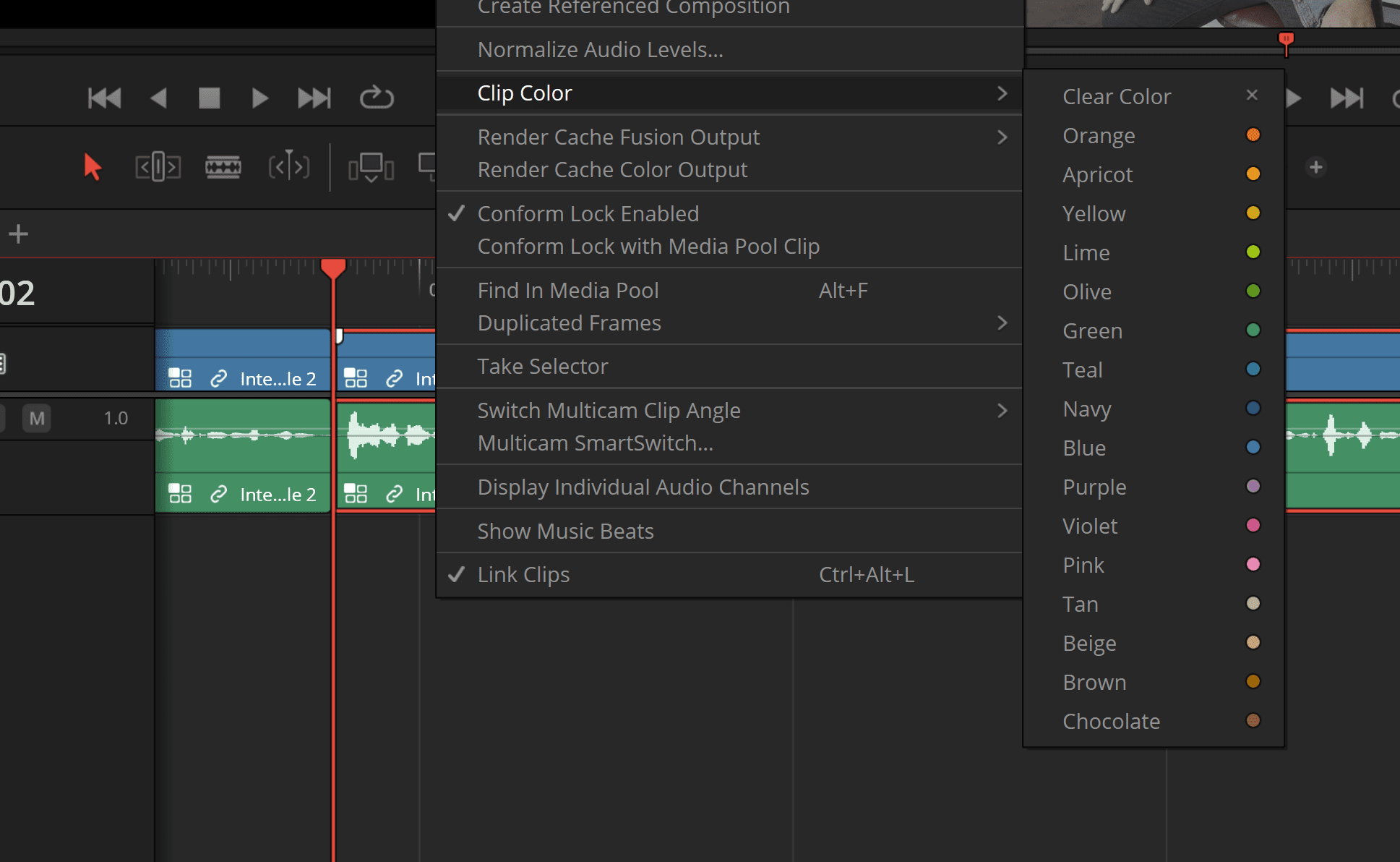 a screenshot of video editing software showcasing a user interface the menu titled clip color displays a selection of color options such as clear color orange and yellow among others timeline tracks feature audio clips in vibrant colors indicating a multilayered editing process digital production A screenshot of video editing software showcasing a user interface. The menu titled 'Clip Color' displays a selection of color options, such as Clear Color, Orange, and Yellow, among others. Timeline tracks feature audio clips in vibrant colors, indicating a multi-layered editing process.
