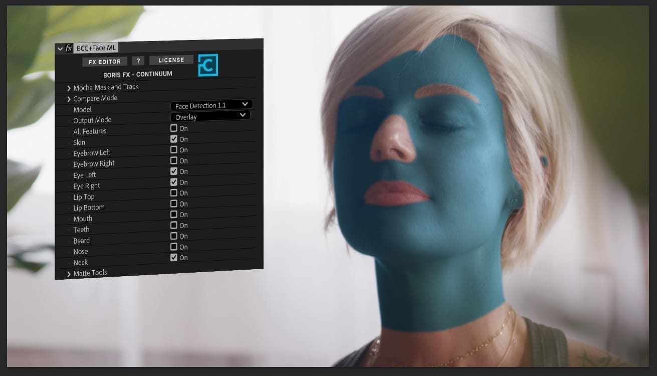 a closeup of a woman with blue face paint eyes closed amid a soft softly lit background the screen beside her displays editing software options including features for facial tracking her short blonde hair contrasts with the vibrant blue highlighting her serene expression digital production A close-up of a woman with blue face paint, eyes closed, amid a soft, softly lit background. The screen beside her displays editing software options, including features for facial tracking. Her short blonde hair contrasts with the vibrant blue, highlighting her serene expression.